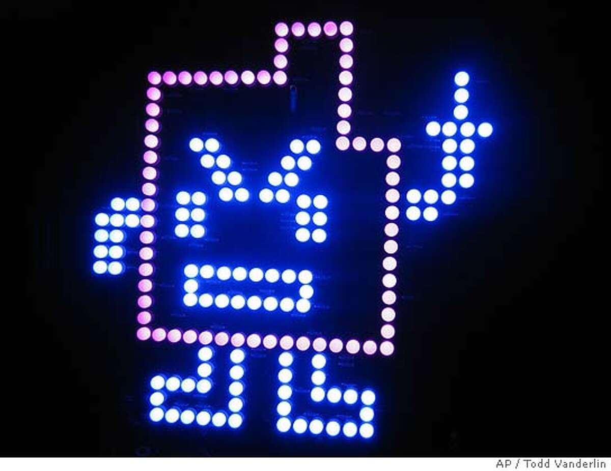 ** EDS NOTE: POSSIBLE OBSCENE GESTURE ** This photo provided by Todd Vanderlin shows an electronic device hanging beneath an overpass in Boston, Monday Jan. 15, 2007. The device consists of light emitting diodes on a circuit board forming the shape of a gesturing character which is part of a promotion for the TV show "Aqua Teen Hunger Force," a surreal series about a talking milkshake, a box of fries and a meatball, according to Turner Broadcasting, a division of Time Warner Inc. and parent of Cartoon Network. Other similar devices, planted at bridges and other spots in Boston threw a scare into the city Wednesday Jan. 31, 2007 in what turned out to be a publicity campaign for the late-night cable cartoon. Highways, bridges and a section of the Charles River were shut down and bomb squads were sent in before authorities declared the devices were harmless. (AP Photo/Todd Vanderlin)