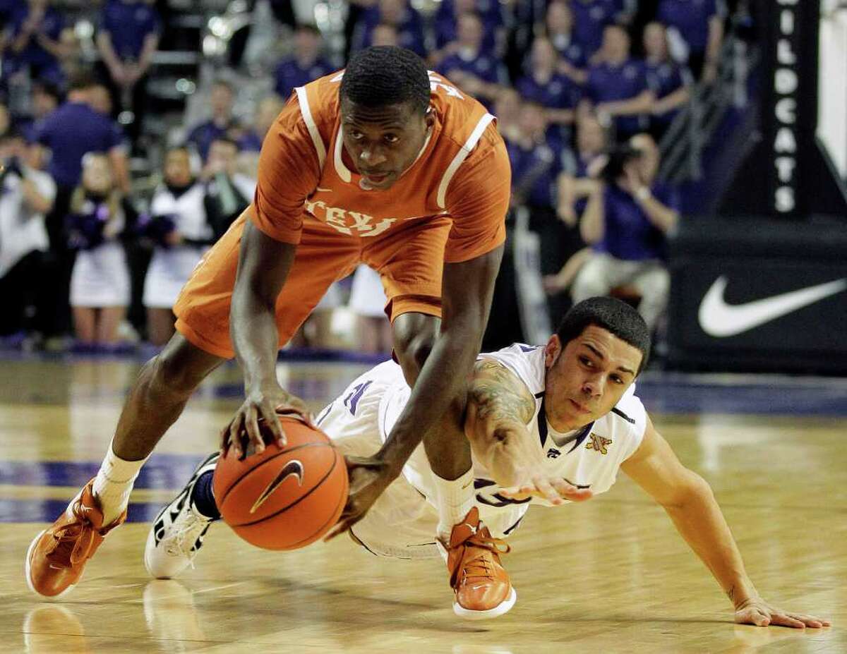 Kansas State's Angel Rodriguez (right) tries to poke the ball away from UT's Myck Kabongo on Wednesday. The young Horns are still learning how to seize control of games in the clutch.