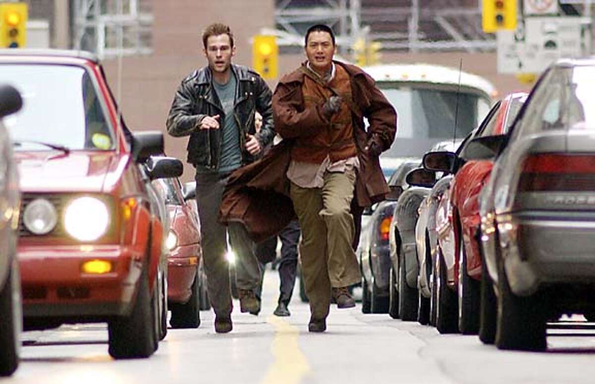 Seann William Scott, left, and Chow Yun-Fat in "Bulletproof Monk." Photo by George Kraychyk