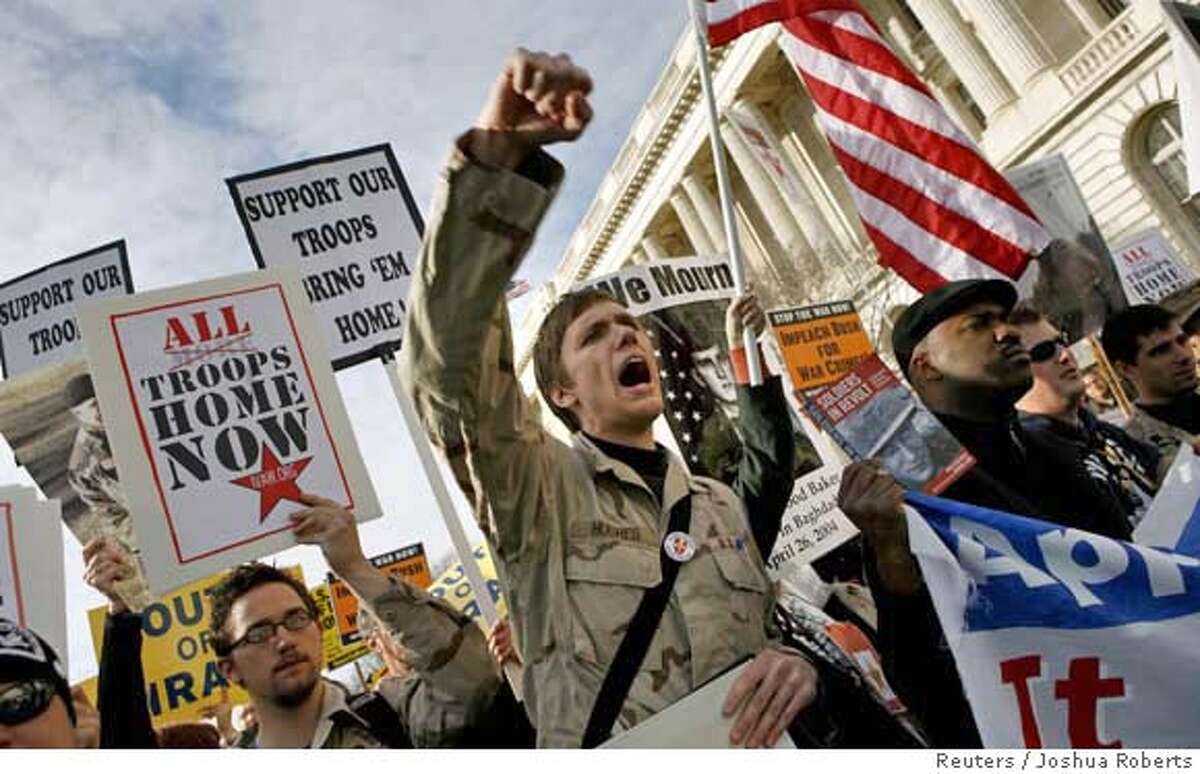 An anti-war demonstrator protests the war in Iraq as thousands of protesters march around the U.S. Capitol in Washington, January 27, 2007. REUTERS/Joshua Roberts (UNITED STATES) 0
