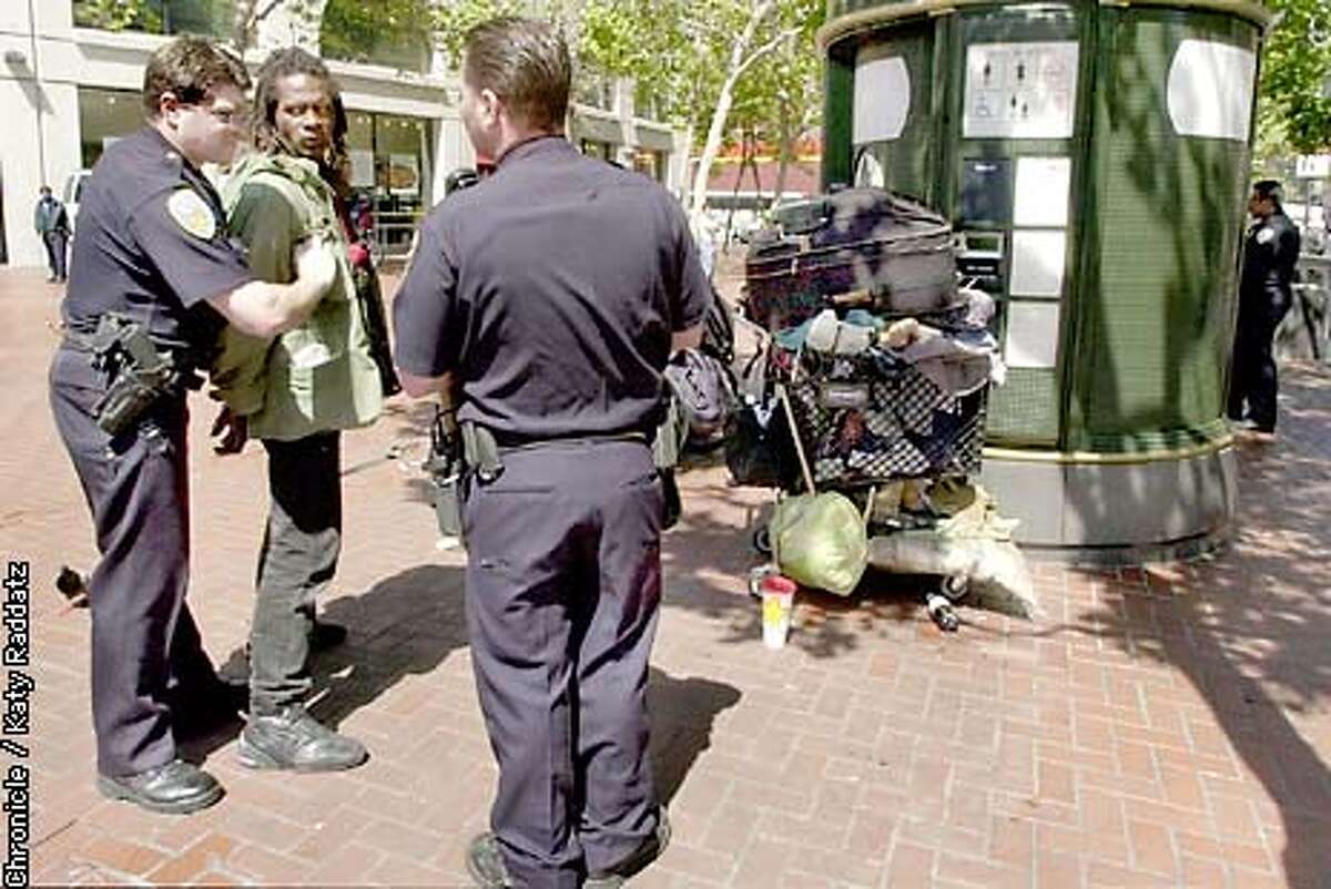 PHOTO BY KATY RADDATZ--THE CHRONICLE San Francisco's UN Plaza has been called a landmark in crisis. We have homeless, drug dealers, drunks doing terrible things in and around the fountain. New design will fill in fountain; archtiect Lawrence Halprin is mad. SHOWN: police detain a denizen of the plaza after a threatened fight--no one was arrested.
