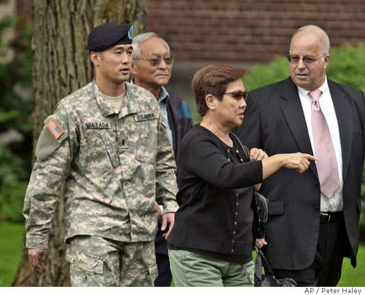 ** CORRECTS NAME OF WOMAN AND RELATIONSHIP ** Army Lt. Ehren Watada, left, walks with father, Bob Watada; his stepmother, Rosa Sakanishi; and attorney, Eric Seitz, during a lunch break in an Army hearing concerning Watada's refusal to deploy to Iraq, at Fort Lewis, Wash., Thursday, Aug. 17, 2006. Watada, 28, of Honolulu, was charged last month with conduct unbecoming an officer, missing troop movement and contempt toward officials. He refused to deploy to Iraq on June 22 with his Stryker unit, the 3rd Brigade, 2nd Infantry Division based at Fort Lewis. (AP Photo/The News Tribune, Peter Haley)