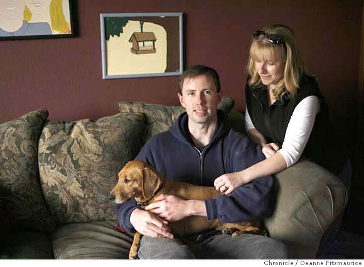 nevius14_0136_df.jpg IN CAPTION BE SURE TO STATE THAT THIS WAS DURING A PORTRAIT SESSION WITH THE CHRONICLE. Josh and Liz Erickson are hoping that Josh does not get deployed again to Iraq. They are with their dog, Rudy. Photographed in Santa Rosa on 1/12/07. Photo / Deanne Fitzmaurice Mandatory credit for photographer and San Francisco Chronicle. /Magazines out.