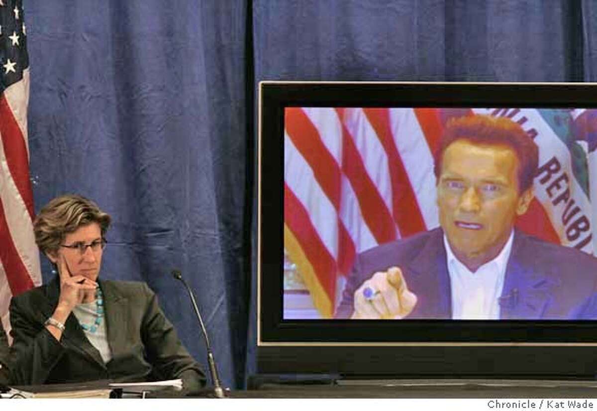 GOV_HEALTHCARE_0068_KW_.jpg Governor Arnold Schwarzenegger (RIGHT) (VIA SATELITE due to his broken leg and restrictions on traveling) announces his health care reforms plans while Kim Belshe, (LEFT) Secretary California Health and Human Services Agency, listens before detailing the governor's plan with a panel of speakers at the California Department of Health Services auditorium in Sacramento Monday January 7, 2007. Kat Wade/The Chronicle Mandatory Credit for San Francisco Chronicle and photographer, Kat Wade, Mags out