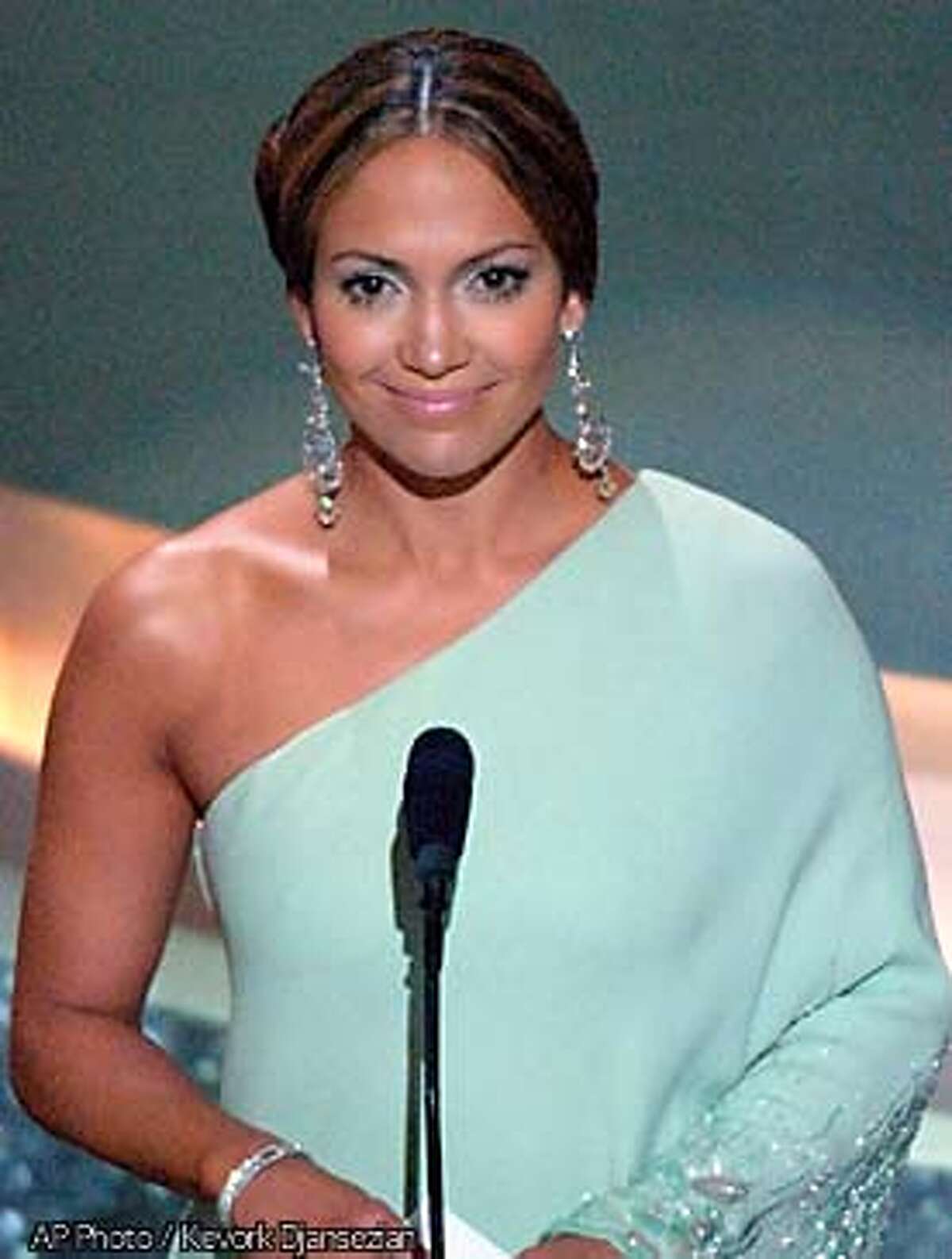 **EMBARGOED AT THE REQUEST OF THE MOTION PICTURE ACADEMY FOR USE UPON CONCLUSION OF ACADEMY AWARDS TELECAST** Actress Jennifer Lopez presents the award for art direction at the 75th annual Academy Awards on Sunday, March 23, 2003, in Los Angeles. (AP Photo/Kevork Djansezian)