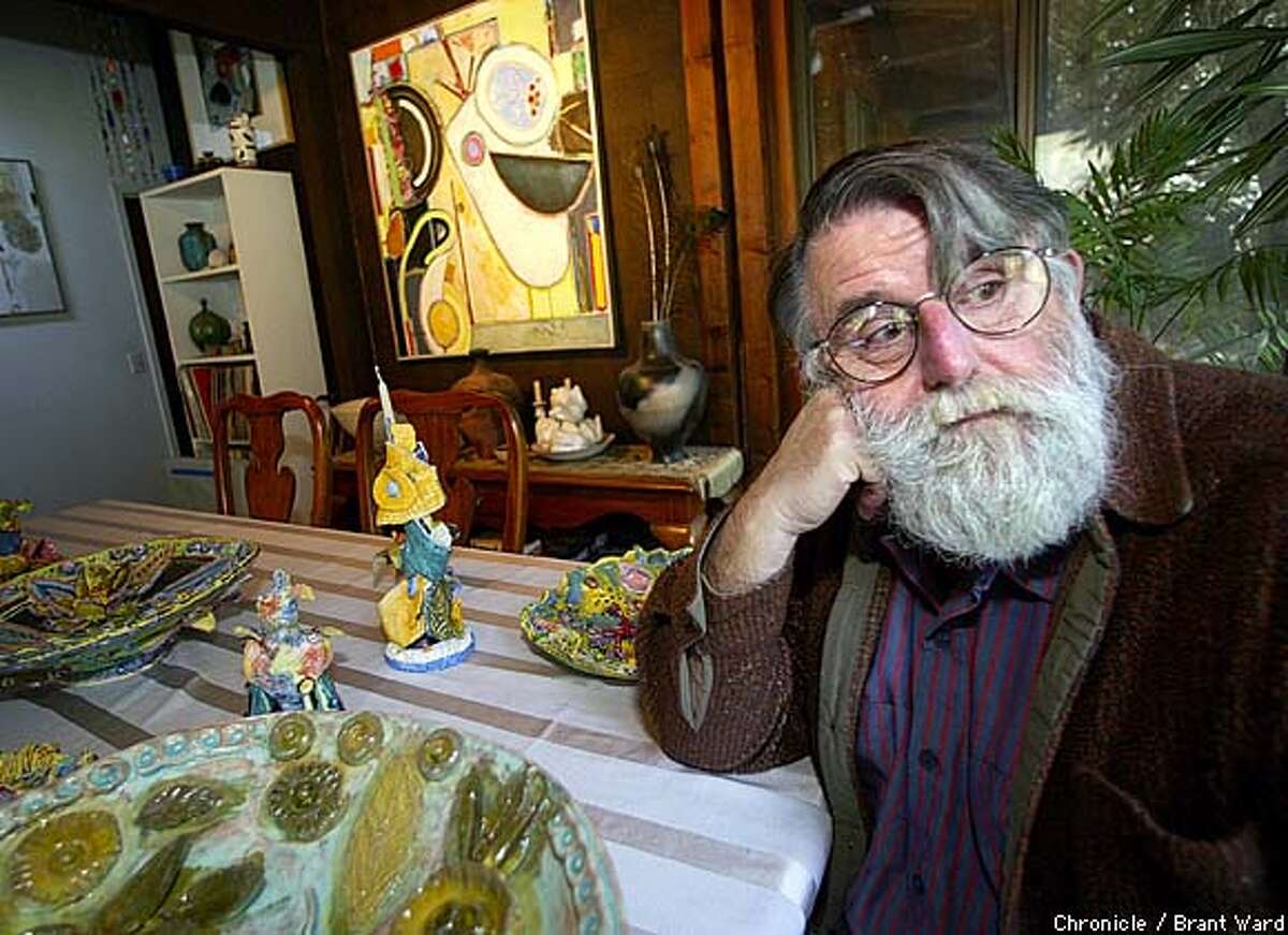 Harley sits at the table of his Russian River home surrounded by some of his ceramic creations. The artist does superbly detailed stamps from imaginary countries. By Brant Ward/Chronicle