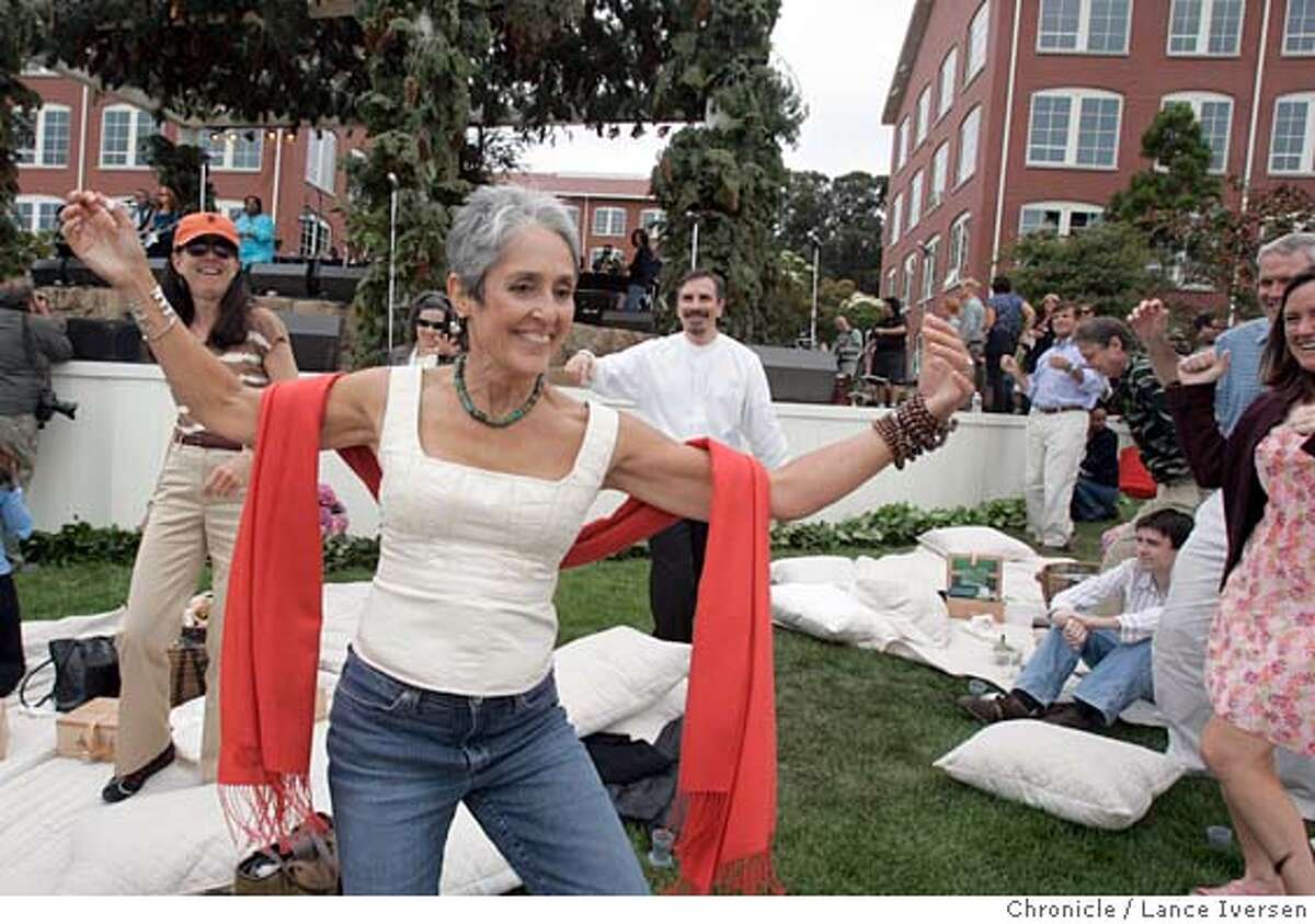 #2_440.jpg_ Singer-composer Joan Baez dances to the music during the concert portion of the calibration of the opening of George Lucas' Letterman Digital Arts Center in the Presidio. By Lance Iversen/San Francisco Chronicle
