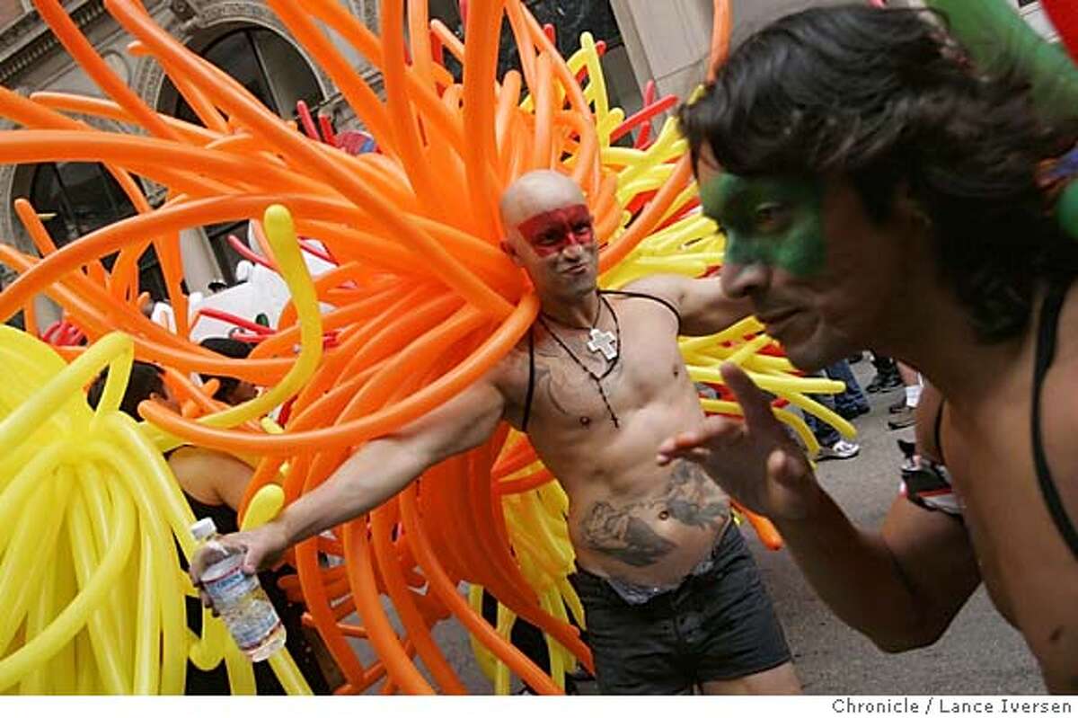 PRIDE27_832.jpg_ Fernando Gonzales from Mexico (with water in hand) was one the the Balloon Magic men that took part in the 35th annual Gay Pride parade Sunday. By Lance Iversen/San Francisco Chronicle MANDATORY CREDIT PHOTOG AND SAN FRANCISCO CHRONICLE.