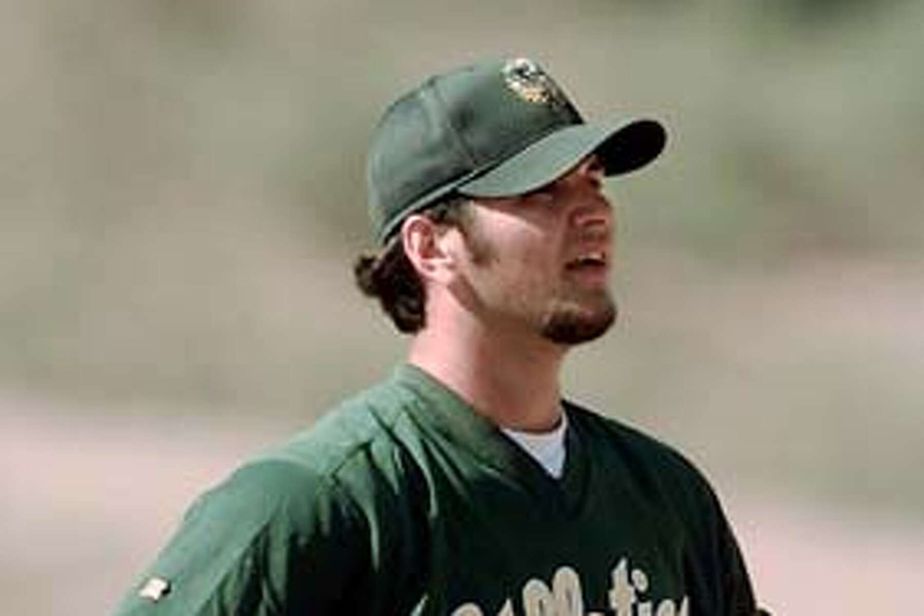 Rookie third baseman Mark McGwire of the Oakland Athletics waits