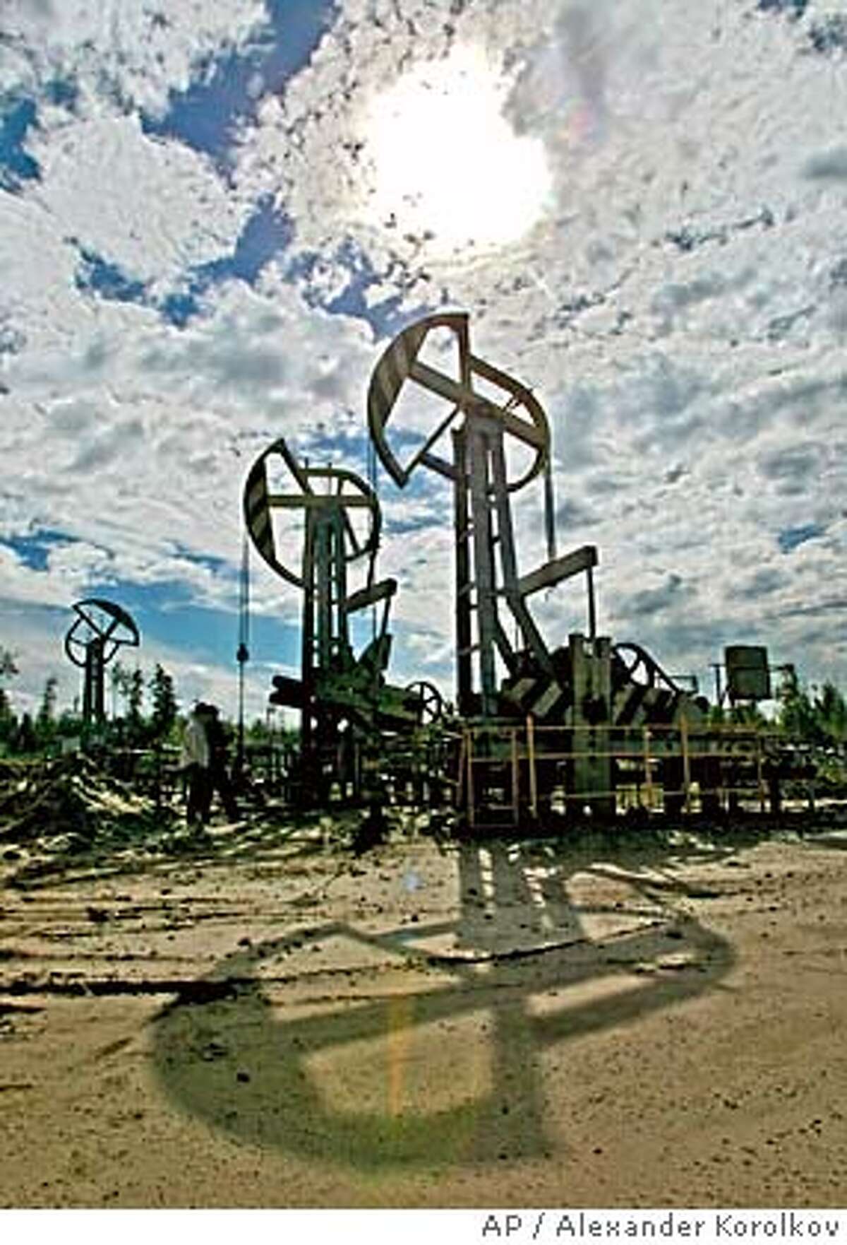 **FILE** Russian oil gaint Yukos oil rig is seen near Tyumen, Western Siberia, about 1675 kilometers (1,000 miles) east of Moscow, in this June 2003 file picture. The oil wing of Russia's state-controlled natural gas giant Gazprom does not intend to pull out of this weekend's auction of the main production unit of the embattled Yukos oil company. An official at the Russian Federal Property Fund, the agency conducting the auction, said Friday, Dec. 17, 2004, that the sale would proceed as planned. (AP Photo/Alexander Korolkov, Izvestia) ** MAGAZINES OUT ** MAGAZINES OUT Business#Business#Chronicle#12/29/2004#ALL#5star##0422521793