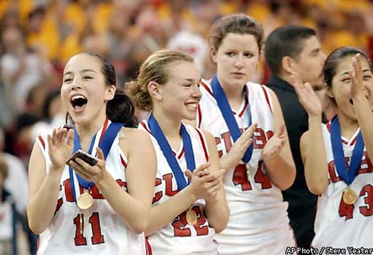 Convent of the Sacred Heart players, from left, Jen Hum-Traverso, Liz Brown, Kathy Catani and Stacey Fong celebrate their 68-59 victory over Mission College Prep in the CIF Division V championship game Friday, March 21, 2003, in Sacramento, Calif. (AP Photo/Steve Yeater)