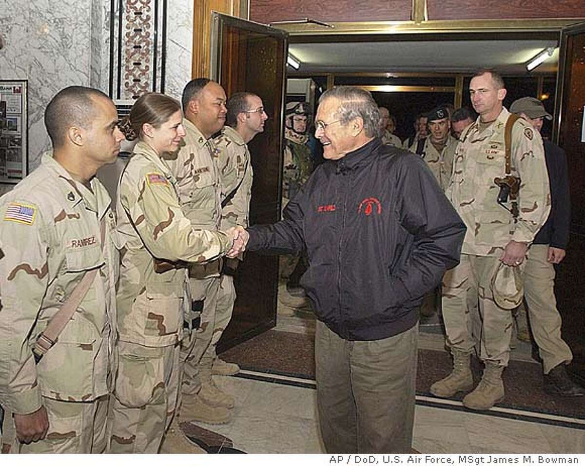 Rumsfeld's Iraq trip received well by troops / But analysts doubt 12