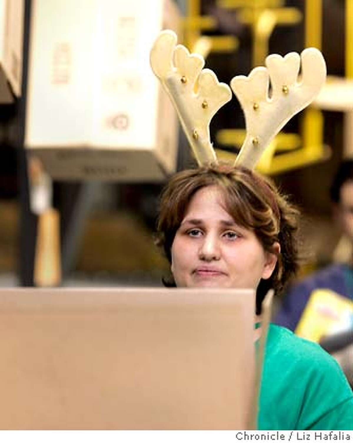 The Amazon.com distribution center in Fernley, NV, during its peak hoilday shopping season. Julie Gerbeler waiting for merchandise to box . Shot on 12/15/04 in Fernley. LIZ HAFALIA/The Chronicle
