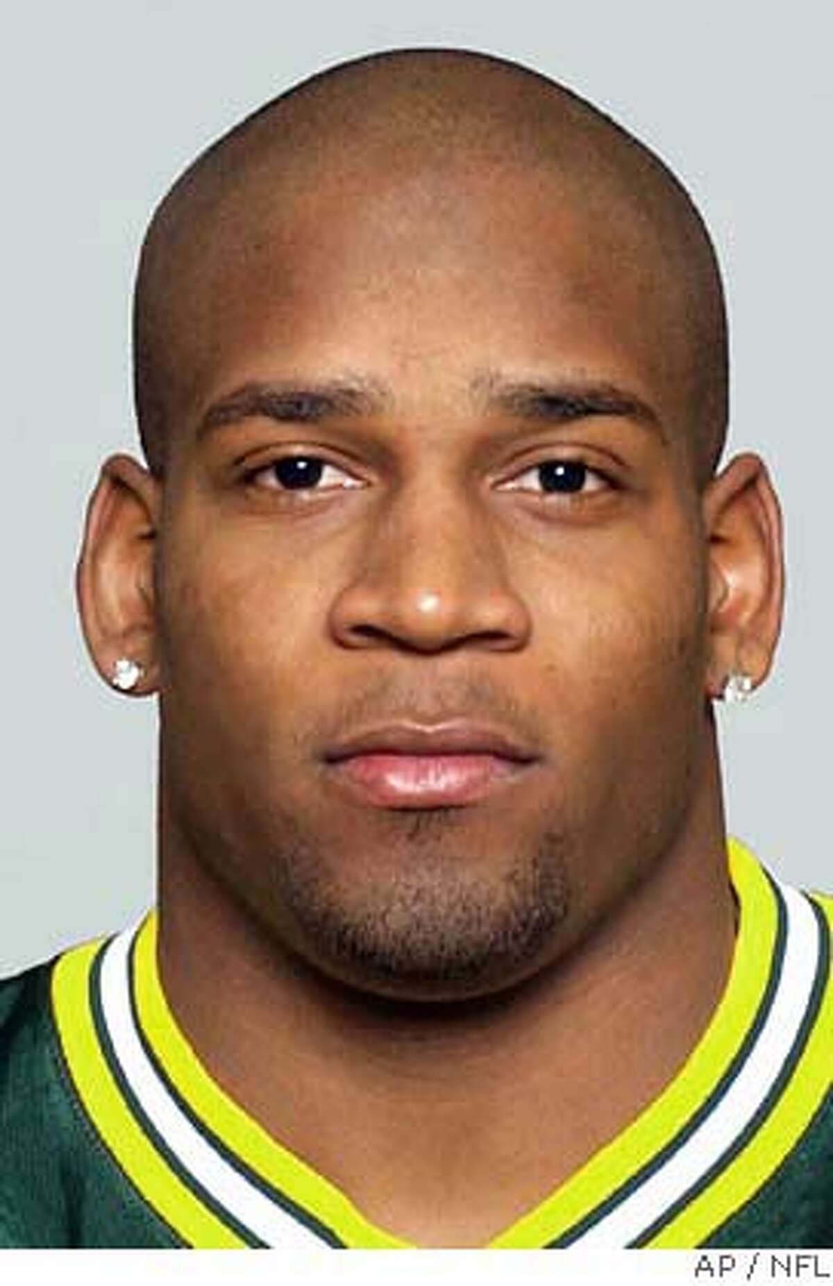 Oakland Raiders safety Marques Anderson and cornerback Charles Woodson are shown in these 2004 hand photos provided by the NFL. Anderson and Woodson were arrested early Monday, Dec. 20, 2004 in Oakland for investigation of public intoxication following the Raiders' victory over the Tennessee Titans on Sunday. (AP Photo/NFL, HO)