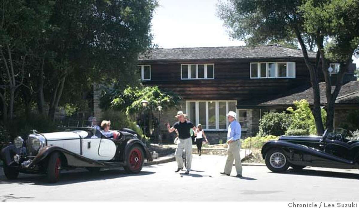 davies14_079_ls.jpg An $18 million dollar fixer-upper? From left: John Hopfenbeck of Burlingame and curator of the Cole car collection; Ellen Cole of Woodside; Robert Cory of San Francisco; and David Buchanan of Palo Alto discuss the best placement for the 1927 Bentley Speed Siz Markham Roadster in front of the Woodside estate. In a real estate saga that could only happen in California -- nay, the Bay Area -- the Woodside estate once owned by San Francisco Symphony benefactor Louise M. Davies is up for sale. But it's not that simple. The 20-acre spread was most recently owned by a dot-com millionaire who went bankrupt and now must sell the place, according to the listing agent. The catch -- the property apparently needs almost $10 million in work. Hence the faraway photo on the cover of the invitation for a preview of the property Monday and the vast staging effort that included 1930s cars and members of a local Art Deco society in costume. Photo taken on 6/13/05 in Woodside, CA. Lea Suzuki/ San Francisco Chronicle MANDATORY CREDIT FOR PHOTOG AND SF CHRONICLE/ -MAGS OUT