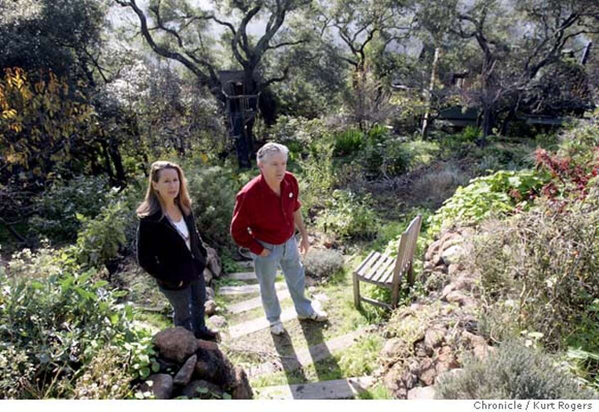 Marine Environmental duo Randy Hayes and his wife Lauren Klein Hayes. in the back yard of their Mill Valley home . He was a founder of Rainforest Action Network, which muscles big companies into changing their enviro policies and practices. She's the co-director of Don't Be Fueled, which is pushing the auto industry to make more hybrid cars. She's also been on the boards and committees of several other enviro groups and foundations 12/11/04 in Mill Valley ,CA. KURT ROGERS/THE CHRONICLE