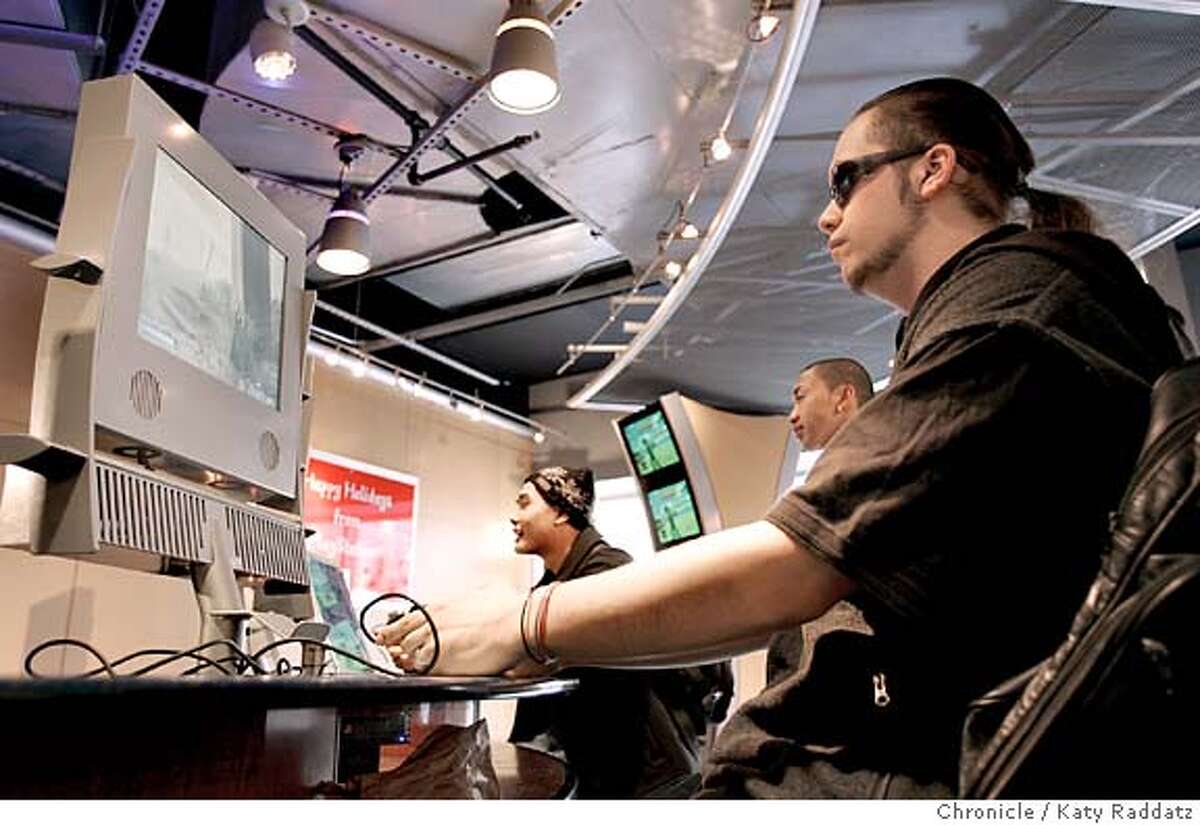 GAMES20_rad.jpg SHOWN: "Clown" of San Francisco plays a video game called Killzone at the Sony PlayStation store at the Metreon. Story about how big the video game industry has become in terms of money and time spent. Katy Raddatz / The Chronicle
