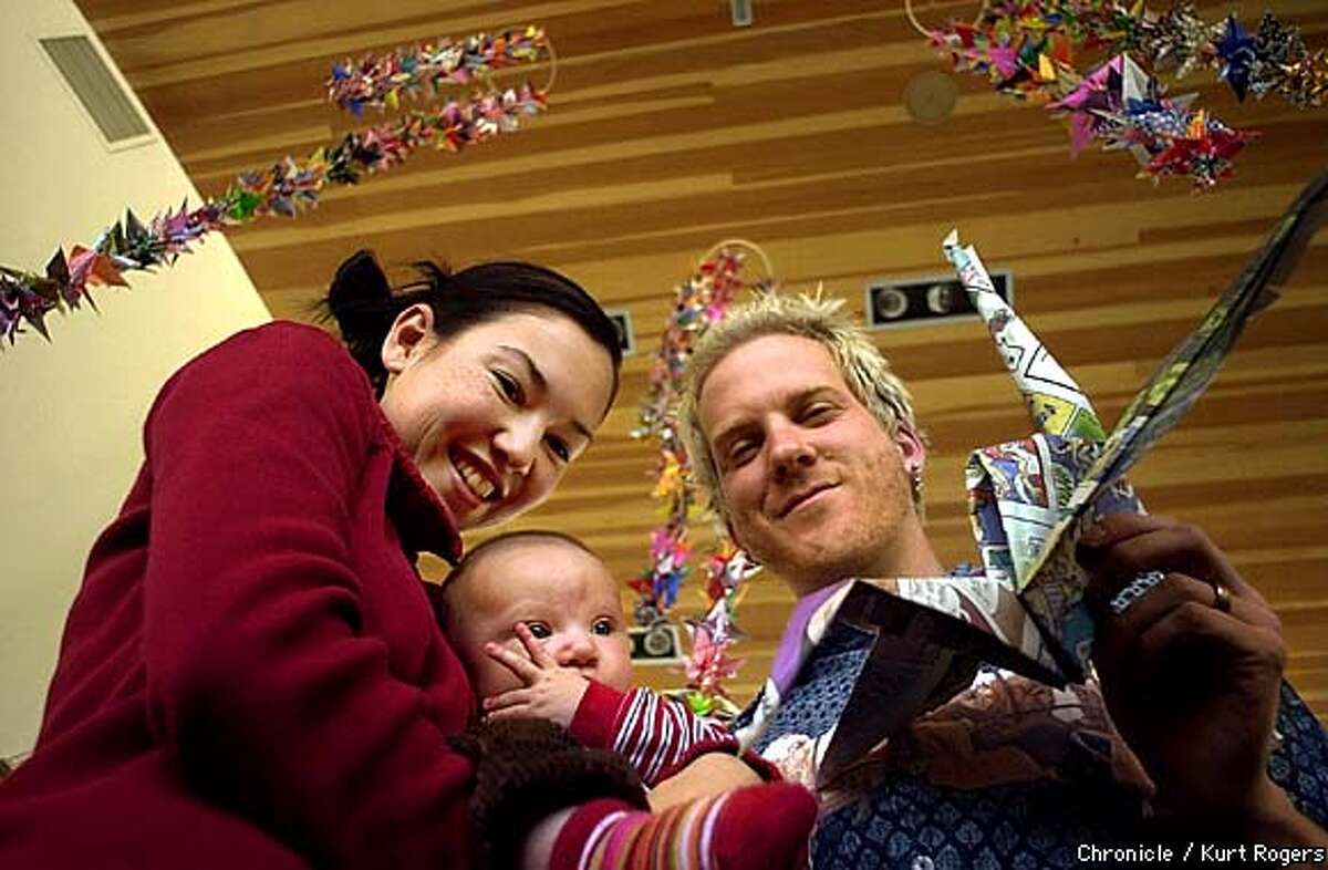 1000 paper cranes at Roshambo winery in Healdsburg with owners Naomi and todd Brilliant and son Justice. the cranes are hanging from the ceiling in the tasting room.Photo By Kurt Rogers