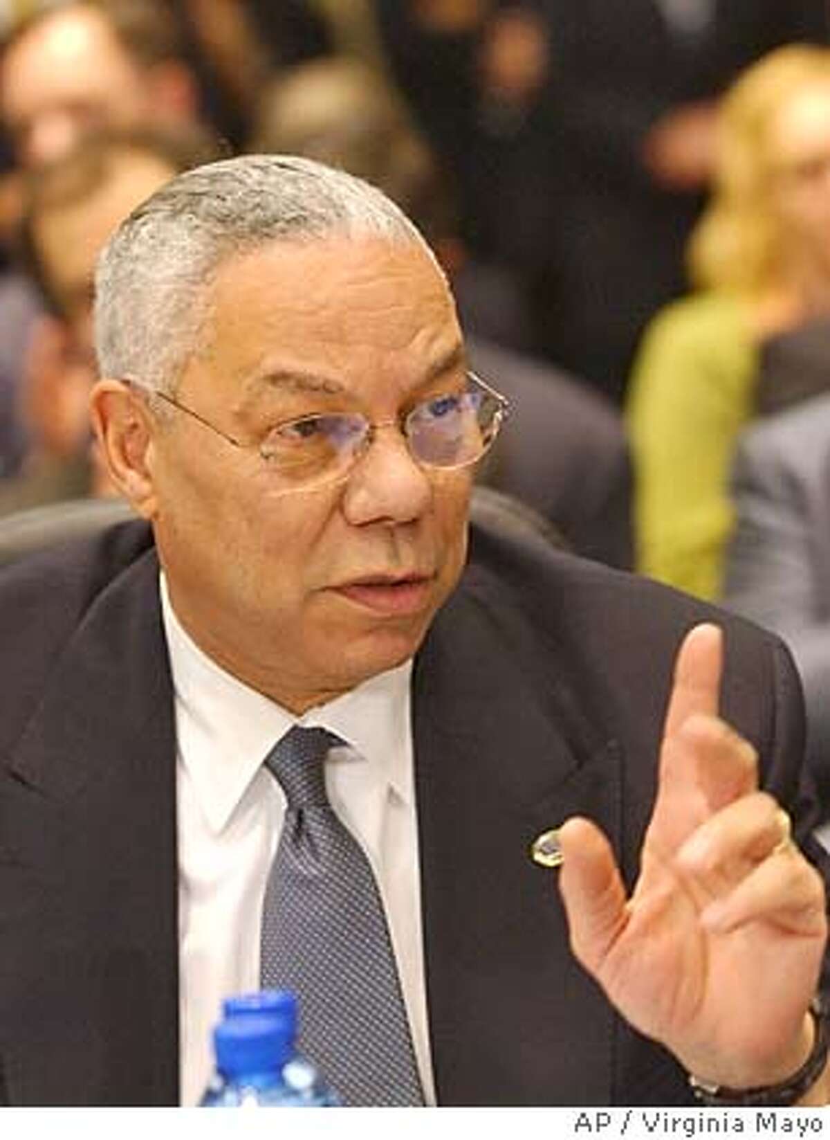 U.S. Secretary of State Colin Powell gestures during a meeting of the Organization of Security and Cooperation in Europe (OSCE) at the Palace of Culture in Sofia, Bulgaria, Tuesday Dec. 7, 2004. Powell rejected on Tuesday Russian charges the West is engaging in political manipulation to expand its influence in Ukraine and other former Soviet republics. (AP Photo/Virginia Mayo)
