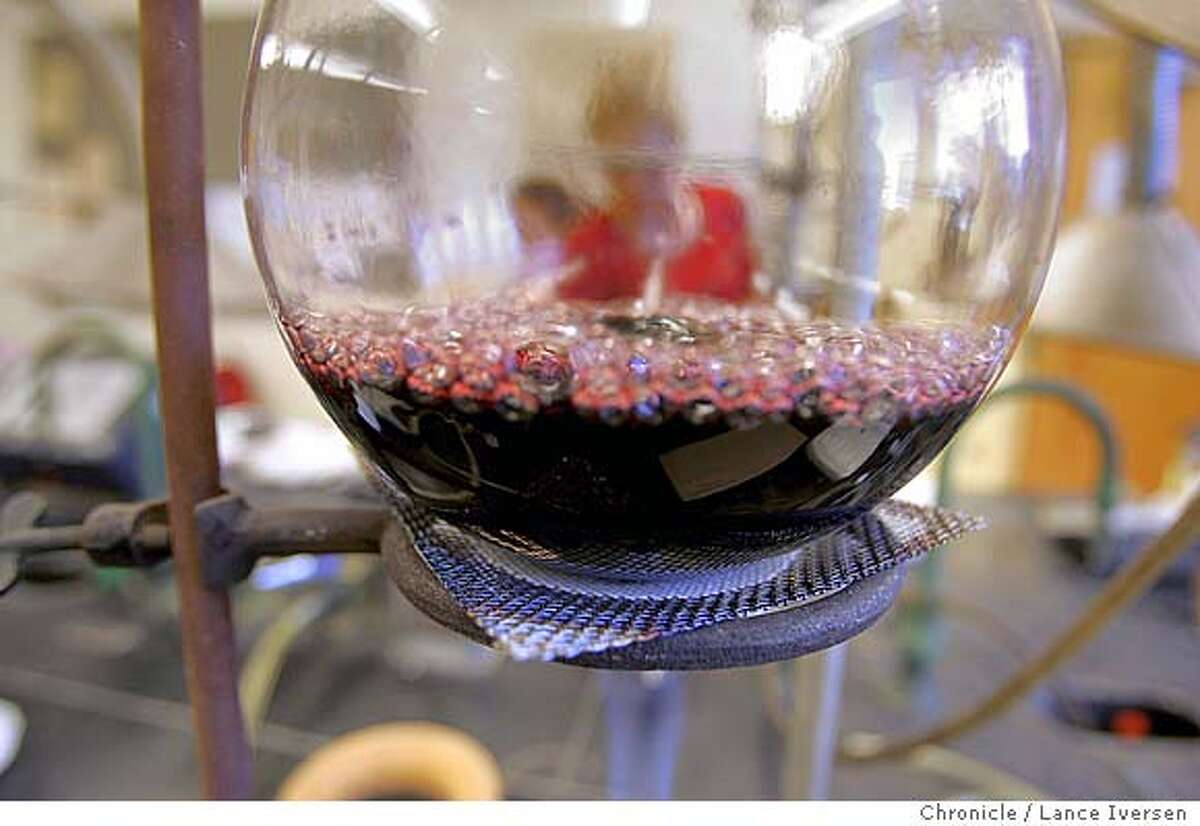 FRESNO050316_LI.JPG_ Heat is used to bowl wine that will help determine color in a class by Professor Barry Gump Ph.D. Fresno State University has the only enology and viticulture program in the country where the students actually make wine and sell it. By Lance Iversen/San Francisco Chronicle MANDATORY CREDIT PHOTOG AND SAN FRANCISCO CHRONICLE. Magazine#Magazine#SundayMagazine#12/05/2004##Advance##0422381470