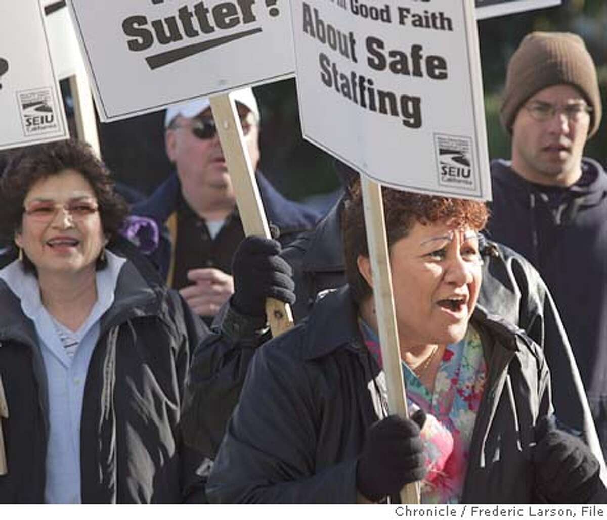 SUTTER_240_fl.jpg A one day strike on 12/1 bought about a lock-out for SEIU workers like Tine Mohi hospital staffer (right foreground) and member of local 250 (Healthcare Union) now finds herself walking the picket line with her brothers and sister in front of the entrance of Alta Bates Hospital in Berkeley.12/2/04 Berkeley CA Frederic Larson The San Francisco Chronicle Ran on: 12-03-2004 Workers picket outside Alta Bates hospital in Berkeley, where they were locked out after staging a one-day strike Wednesday. Ran on: 12-03-2004 Marwan Barghouti