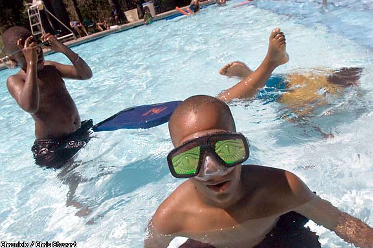 Marquis Phillip, 11, models alien swim goggles at Camp Mather. Chronicle photo by Chris Stewart