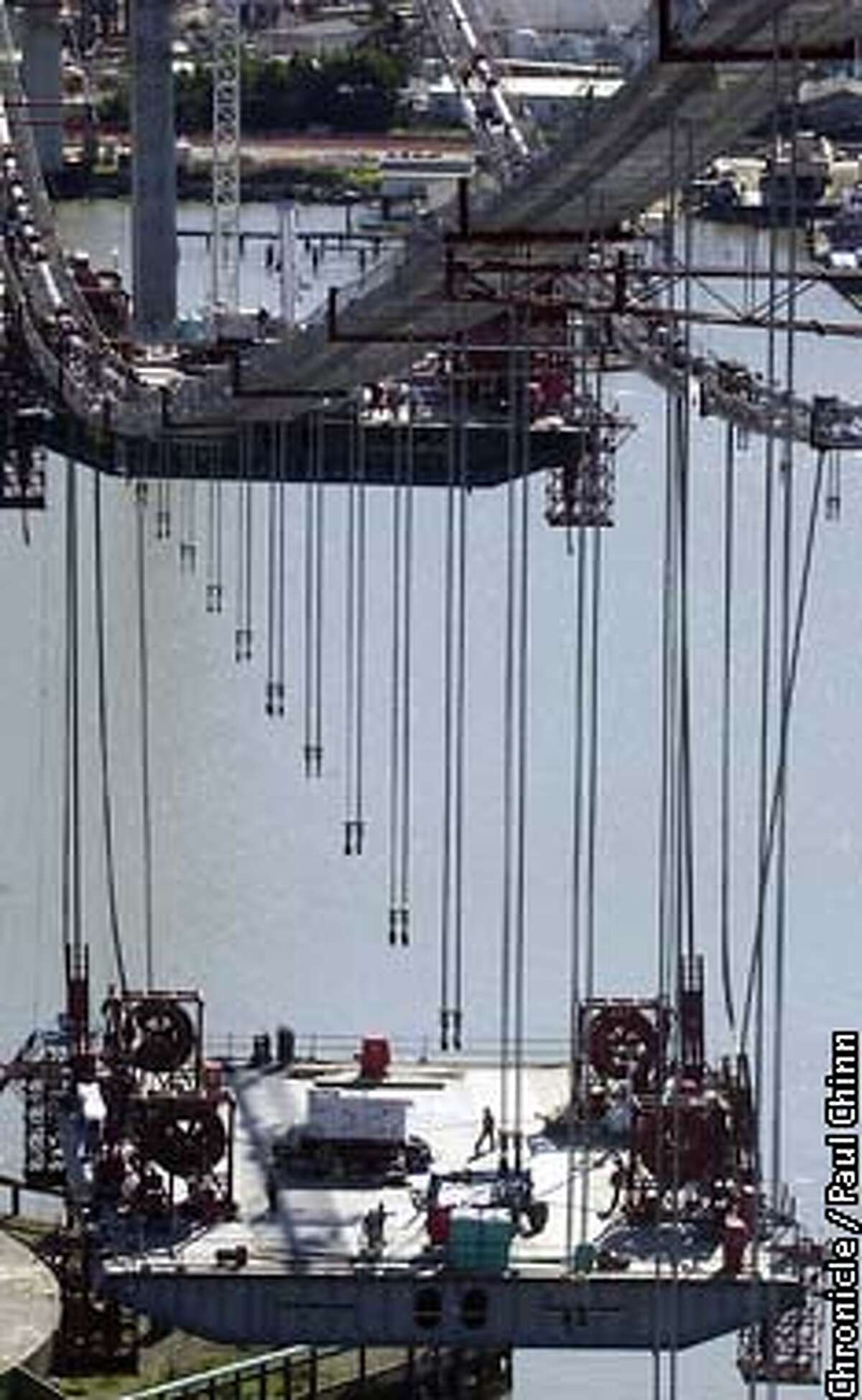 The center sections of roadway are being lifted into place on the new suspension-style Carquinez Bridge. PAUL CHINN/SF CHRONICLE