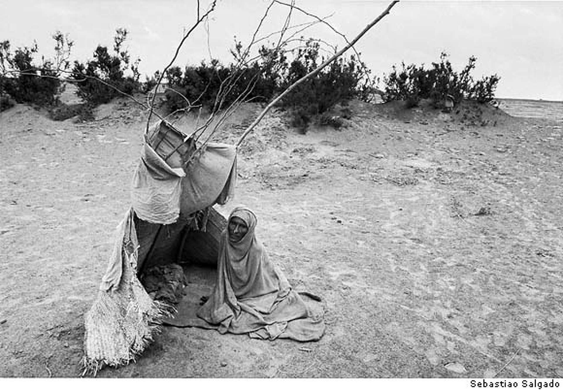 Salgado takes photos of suffering. But he doesn