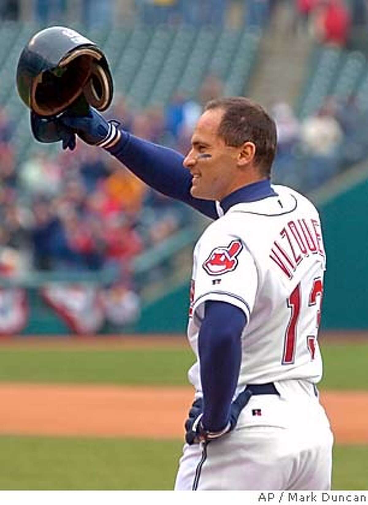 Cleveland Indians' Omar Vizquel waves to the crowd after collecting his 2,000th career hit Thursday, April 22, 2004, in Cleveland. Vizquel singled in the eighth inning off Kansas City Royals reliever Jason Grimsley in the Indians' 5-4 win. (AP Photo/Mark Duncan) Ran on: 09-05-2004 ALSO RAN 9/5/2004 Sports#Sports#Chronicle#11/15/2004#ALL#5star##0421729321