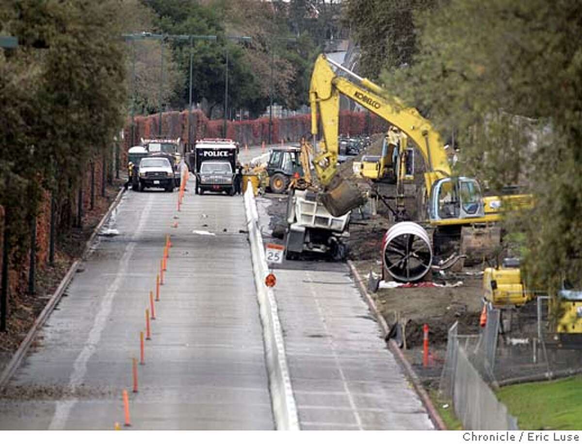 Police officers on Wednesday, Nov. 10, 2004, cordon off the site of a Tuesday explosion in Walnut Creek, Calif. Two people remained missing Wednesday, after an underground fuel pipeline exploded when it was struck accidentally by a construction crew extending a water line. The two missing were part of a construction team that accidentally hit a fuel pipeline. (AP Photo/San Francisco Chronicle, Eric Luse) MAGS OUT MANDATORY CREDIT Metro#Metro#Chronicle#11/13/2004#ALL#5star##0422460631