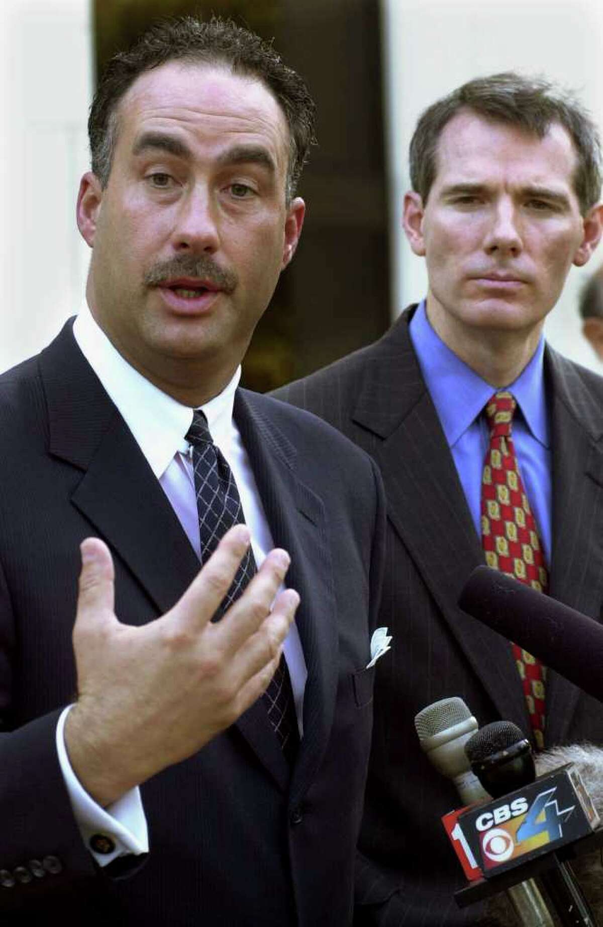 Former U.S. Rep. John Sweeney, R-Clifton Park, speaks at a news conference in Miami Nov. 19, 2000, as Rep. Rob Portman, R-Ohio, looks on at right. The two were commenting on the vote recount going on in Miami-Dade County. Sweeney later became a target of a Justice Department investigation related to his congressional duties and ties to an Albany lobbyist, William D. Powers. (AP Photo/Marta Lavandier)