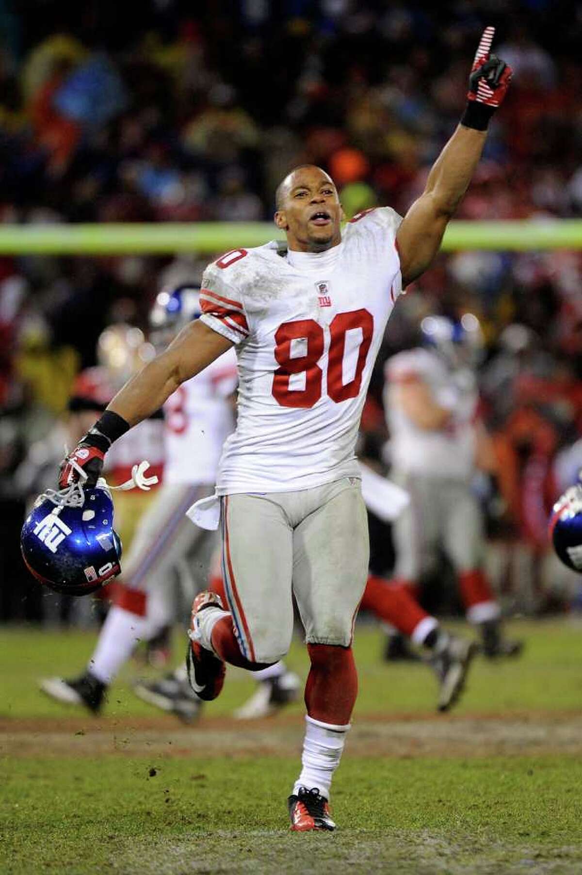 SAN FRANCISCO, CA - JANUARY 22: Victor Cruz #80 of the New York Giants celebrates after the Giants won 20-17 in overtime against the San Francisco 49ers during the NFC Championship Game at Candlestick Park on January 22, 2012 in San Francisco, California. (Photo by Thearon W. Henderson/Getty Images)
