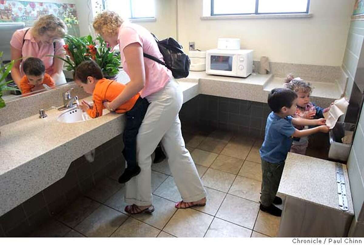 lifestyle28_097_pc.jpg Lisa Hays and her triplets Jacob, Griffin and Sierra wash up in the new family restroom at Valley Fair shopping mall on 4/26/05 in San Jose, CA. The bathroom features a microwave to heat baby bottles. In an effort to change the shopping experience, developers are setting up �lifestyle� centers, like Santana Row, which try to mimic your average Main Street, with tree-lined sidewalks and chain stores that look like boutiques. Meanwhile, malls like Valley Fair across the street are trying to stay relevant, undergoing makeovers to seem more modern and inviting. PAUL CHINN/The Chronicle MANDATORY CREDIT FOR PHOTOG AND S.F. CHRONICLE/ - MAGS OUT