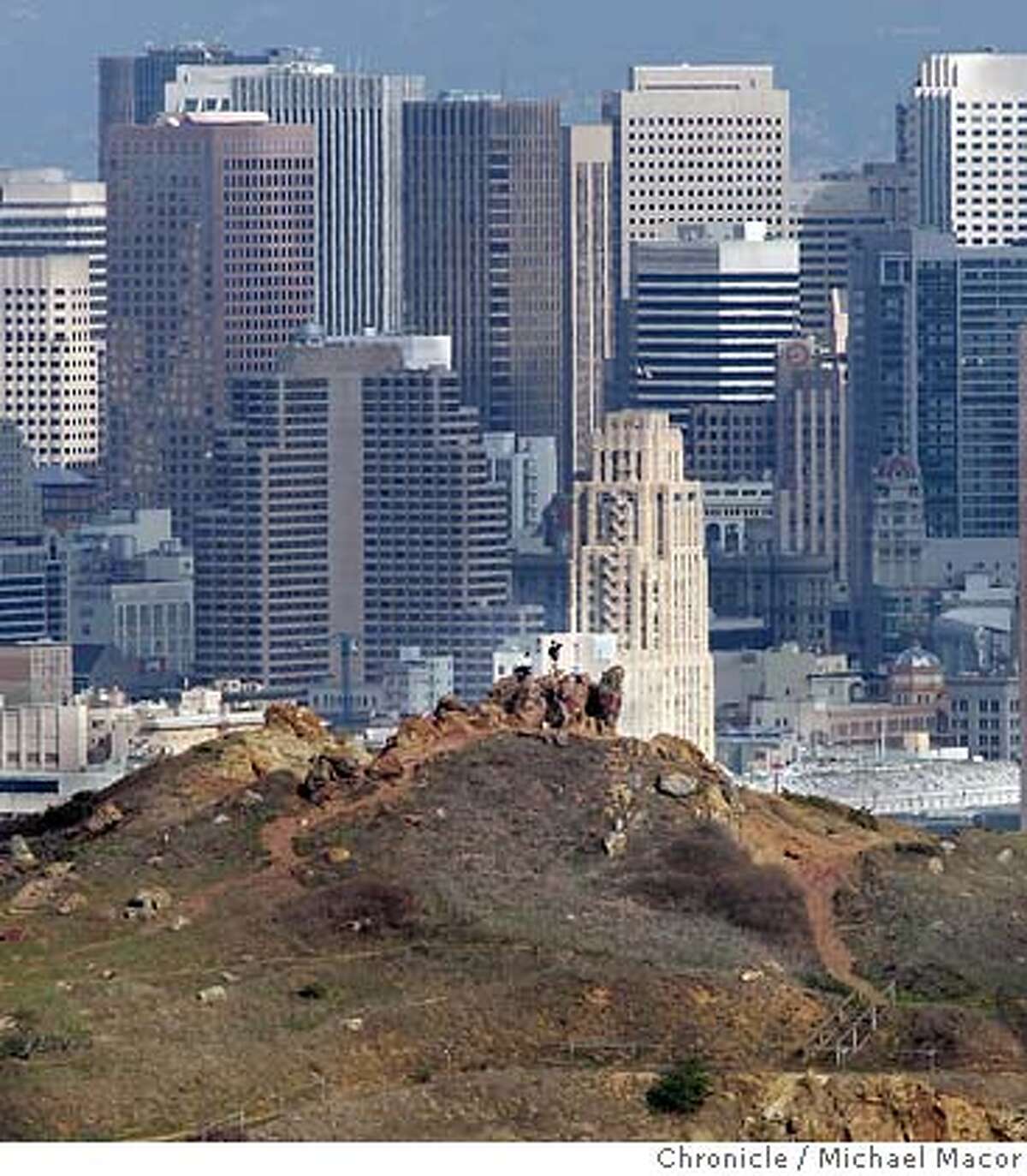 Corona Heights rises 510' giving viewers a spectacular view around the city. Shot from Tank Hill. Walking man series by Tom Graham. This time it is on the 53 hills of San Francisco. 10/30/04 San Francisco, CA Michael Macor / San Francisco Chronicle