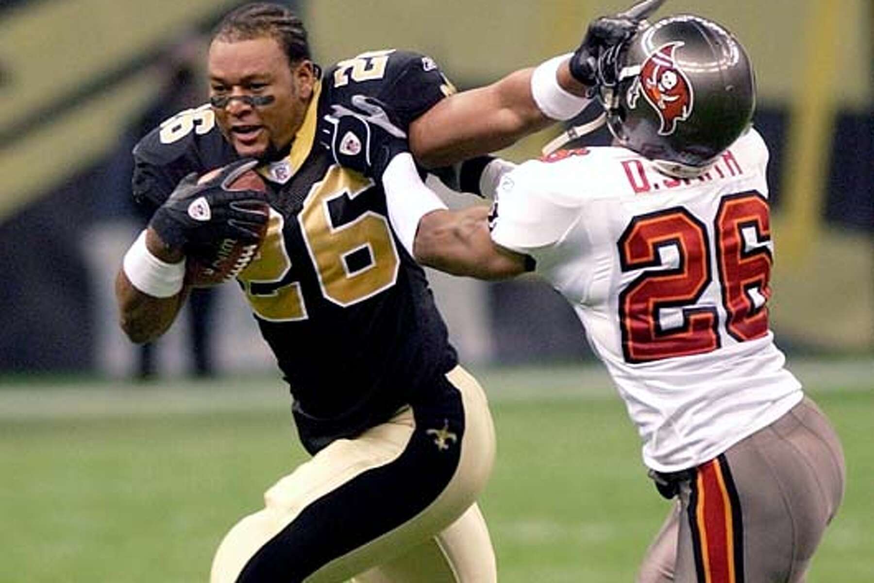 New Orleans Saints running back Deuce McAllister (26) turns the