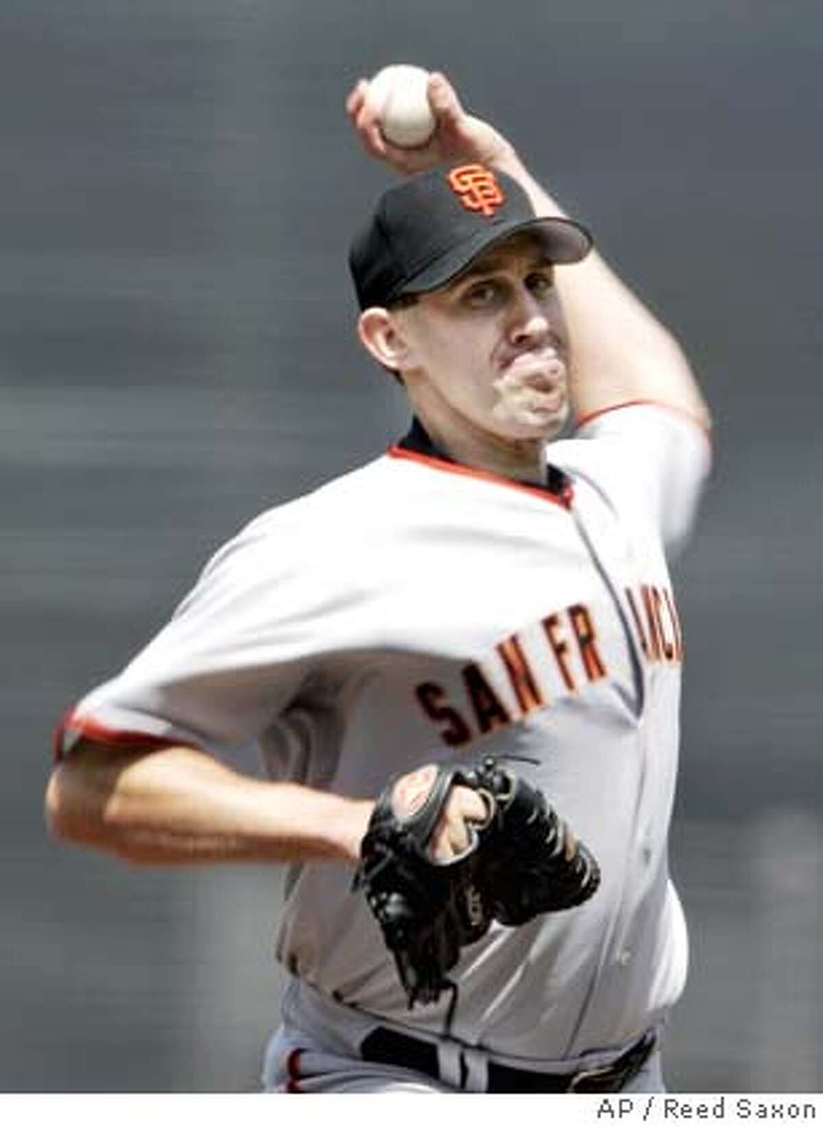 San Francisco Giants second baseman Jason Ellison, right, throws