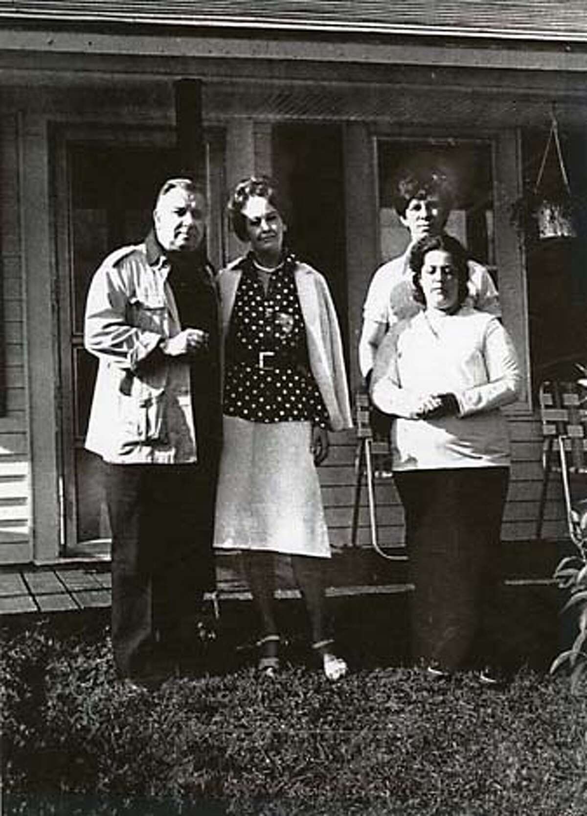 Demonologist Ed and Lorraine Warren (left) with Lui and Dale Passetto, whose home was supposedly inhabited by super natural forces. Credit: UPI 1981.