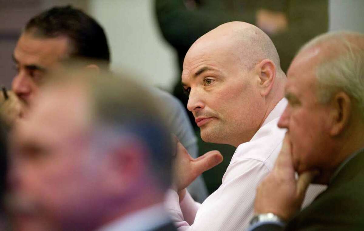 Eric Naposki looks toward jurors as they are polled following a guilty verdict at Orange County Superior Court in Santa Ana, Calif. Thursday July 14, 2011. A jury on Thursday found the former New England Patriots and Indianapolis Colts linebacker guilty of killing Southern California millionaire William McLaughlin nearly 17 years ago. (AP Photo/H. Lorren Au Jr., Pool)