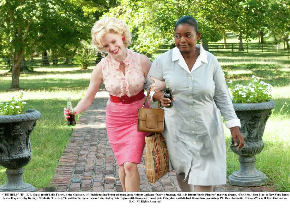 "THE HELP" - TH-133R - Social misfit Celia Foote (Jessica Chastain, left) befriends her bemused housekeeper Minny Jackson (Octavia Spencer, right), in DreamWorks Pictures' inspiring drama, "The Help," based on the New York Times best-selling novel by Kathryn Stockett. "The Help" is written for the screen and directed by Tate Taylor, with Brunson Green, Chris Columbus and Michael Barnathan producing. Ph: Dale Robinette DreamWorks II Distribution Co., LLC. All Rights Reserved.