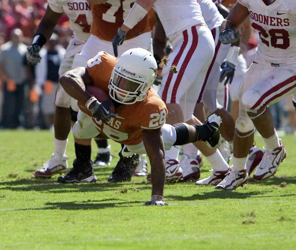 Texas running back Fozzy Whittaker fights for yardage during the second half of The University of Texas and Oklahoma University's match-up in the Red Rivalry at the Cotton Bowl at the State Fair of Texas, in Dallas Texas ,October 17, 2009. (BILLY SMITH II /CHRONICLE)