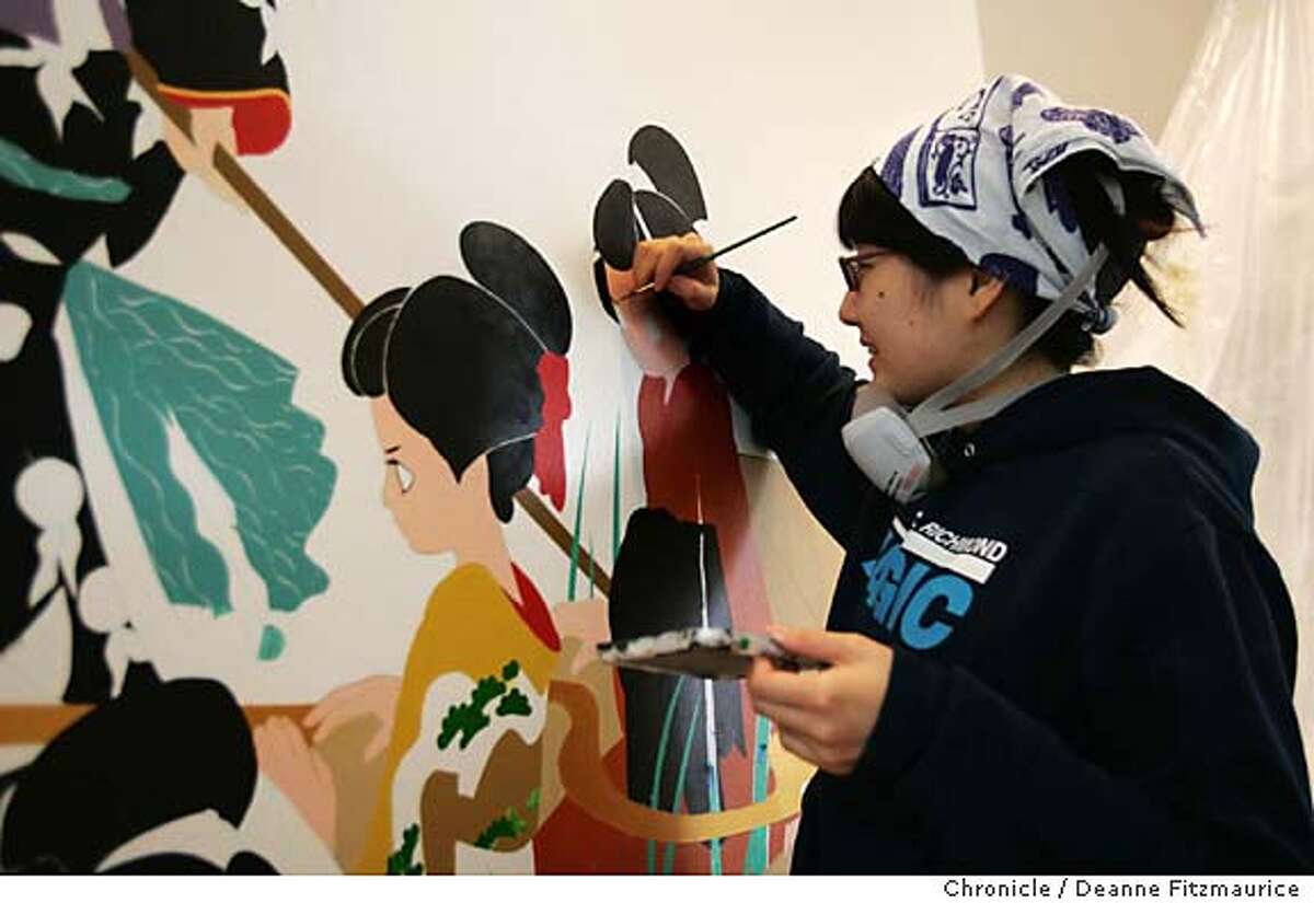 Famed Japanese artist Ai Yamaguchi paints a mural on the wall in the soon to be opened Shu Uemura cosmetics store on Fillmore Street. San Francisco Chronicle photo by Deanne Fitzmaurice