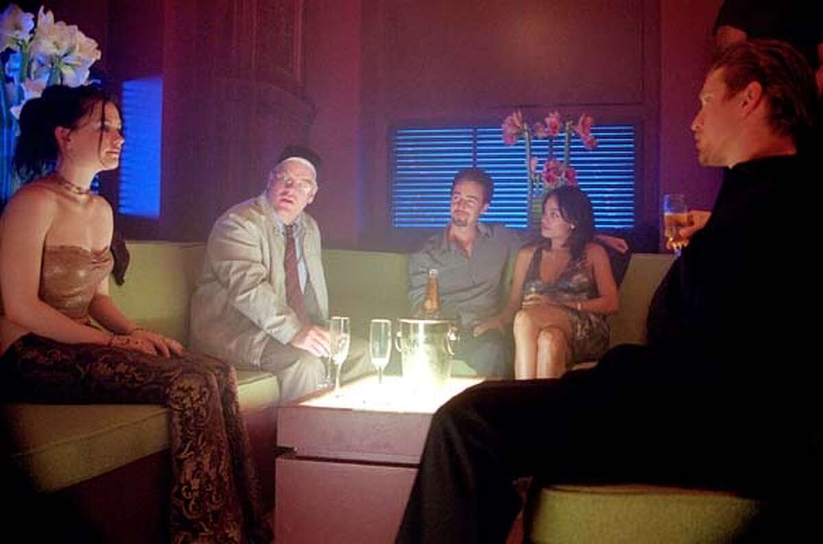 In Spike Lee's "25th Hour," Monty Brogan (played by Edward Norton) rounds up his friends for one last outing to a swank nightclub the night before he starts a seven-year prison term for drug crimes. From left: Anna Paquin, Philip Seymour Hoffman, Norton, Rosario Dawson and Barry Pepper.