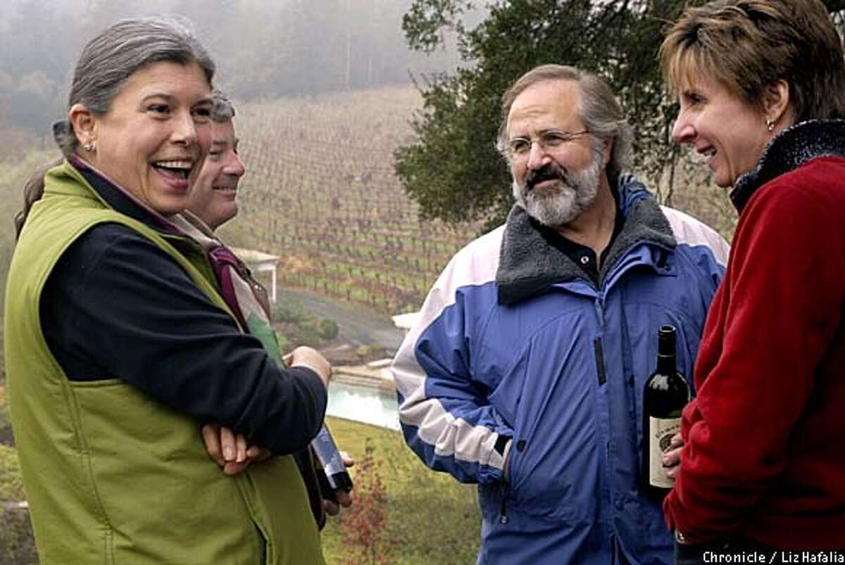 Diamond: Dawnine Dwyer (left, front) and Hal Taylor (left, back) talk wine at at Diamond Creek Vineyards with Phil Steinschriber (middle) and Maureen Taylor (right). Chronicle photo by Liz Hafalia