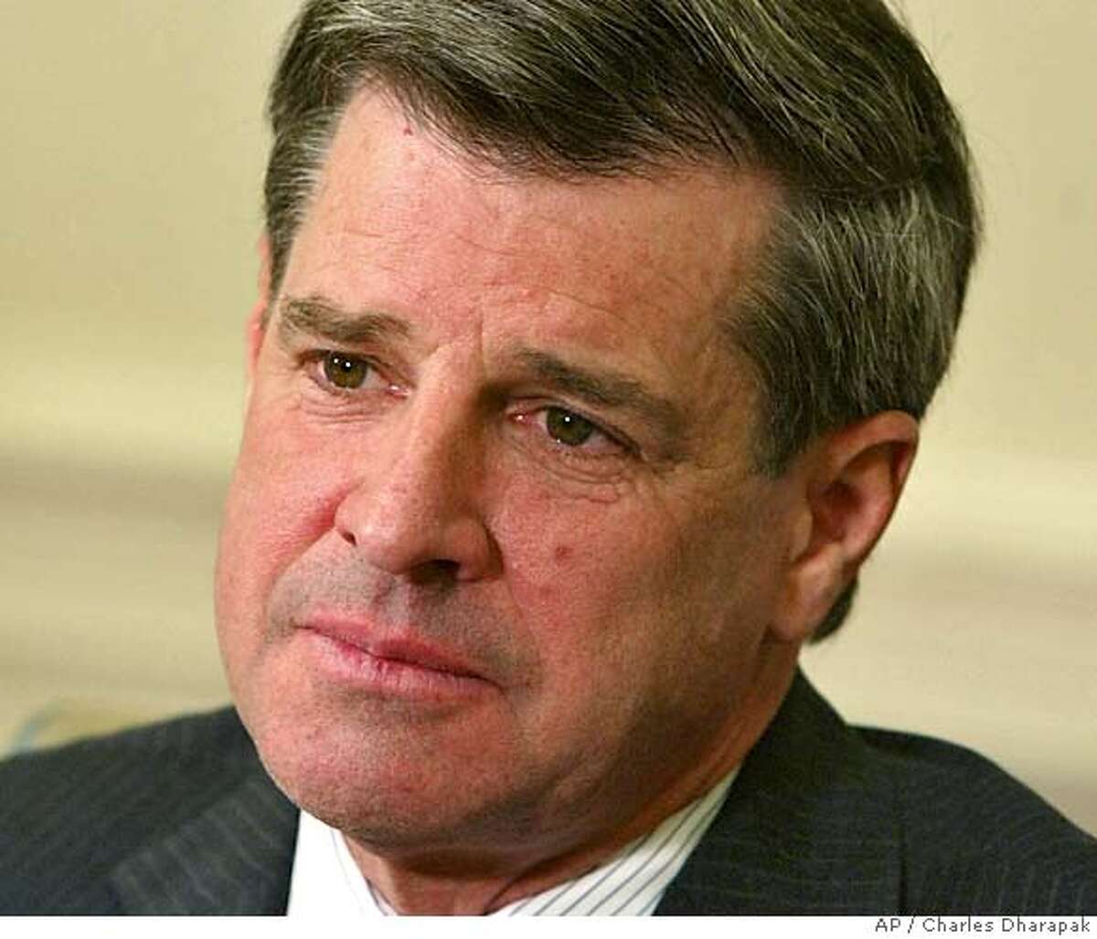 ** FILE ** L. Paul Bremer, the top U.S. civilian official in Iraq, listens as President Bush (not pictured) speaks to reporters during their meeting in the Oval Office of the White House in this Oct. 28, 2003 photo in Washington. The White House refused to say Tuesday, Oct. 5, 2004, whether Bremer had asked Bush for more troops to deal with the rapid descent of postwar Iraq into chaos. (AP Photo/Charles Dharapak, File) OCT. 28, 2003 FILE PHOTO Nation#MainNews#Chronicle#10/06/2004#ALL#5star##0422397053