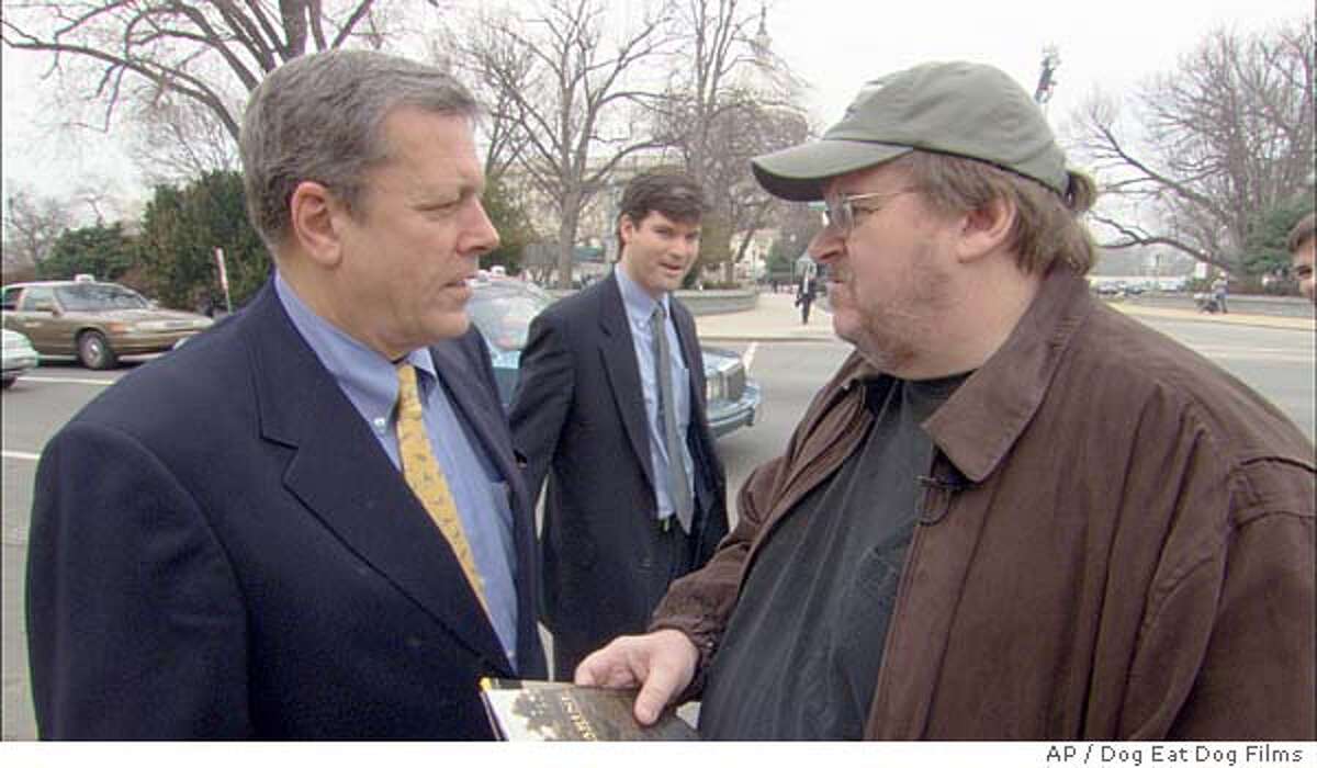 **FILE**Filmmaker Michael Moore, right, talks with Congressman John Tanner, D-Tenn, on Capitol Hill in Washington in a scene from Moore's documentary feature "Farenheit 9/11," in this undated promotional photo. (AP Photo/Dog Eat Dog Films)