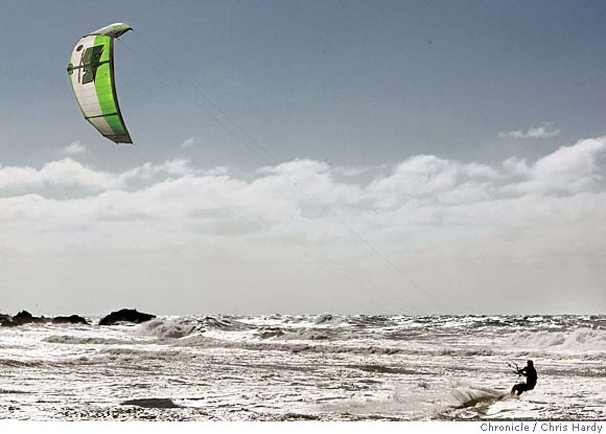 020605_pnkiteboard_ch_038.jpg Kitesurfer Jeff Kafka surfing at Montara Beach. Winter winds are a boon to Peninsula kiteboarders, so we look into the kiteboarding crowd. in Montara 2/6/05 Chris Hardy / San Francisco Chronicle