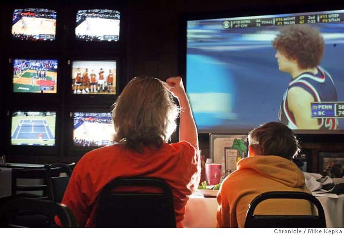 tv068_mk.jpg Betsy Schooley of Casto Valley and Eric Huppert, 10, of Peidmont watch the first round of NCAA championships from Ricky's in San Leandro. Schooley said, "Its interesting to see the baseball players faces every once in a while but, I don't need to hear it." March Madness basketball fan at Ricky's in San Leandro appear to be paying more attention to the first round of college basketball than the congresional hearings involving baseball players and their involvment with steroinds. Mike Kepka / The Chronicle MANDATORY CREDIT FOR PHOTOG AND SF CHRONICLE/ -MAGS OUT