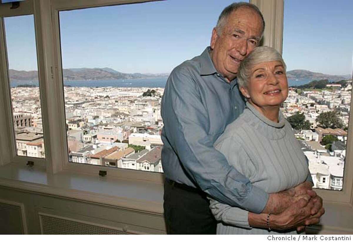 THE COUPLE AND THE VIEW FROM THE CONDO. THE PACIFIC HEIGHTS CONDO OF DR.MARVYN AND DELORES BURKE, WHO AFTER LIVING FOR 42 YEARS IN KENTFIELD, MOVED HERE. FOR STORY ON PEOPLE MOVING BACK TO THE CITY AFTER RAISING THIER FAMILIES INB THE SUBURBS. Event on 9/4/04 in SAN FRANCISCO. S.F. Chronicle Photo: Mark Costantini