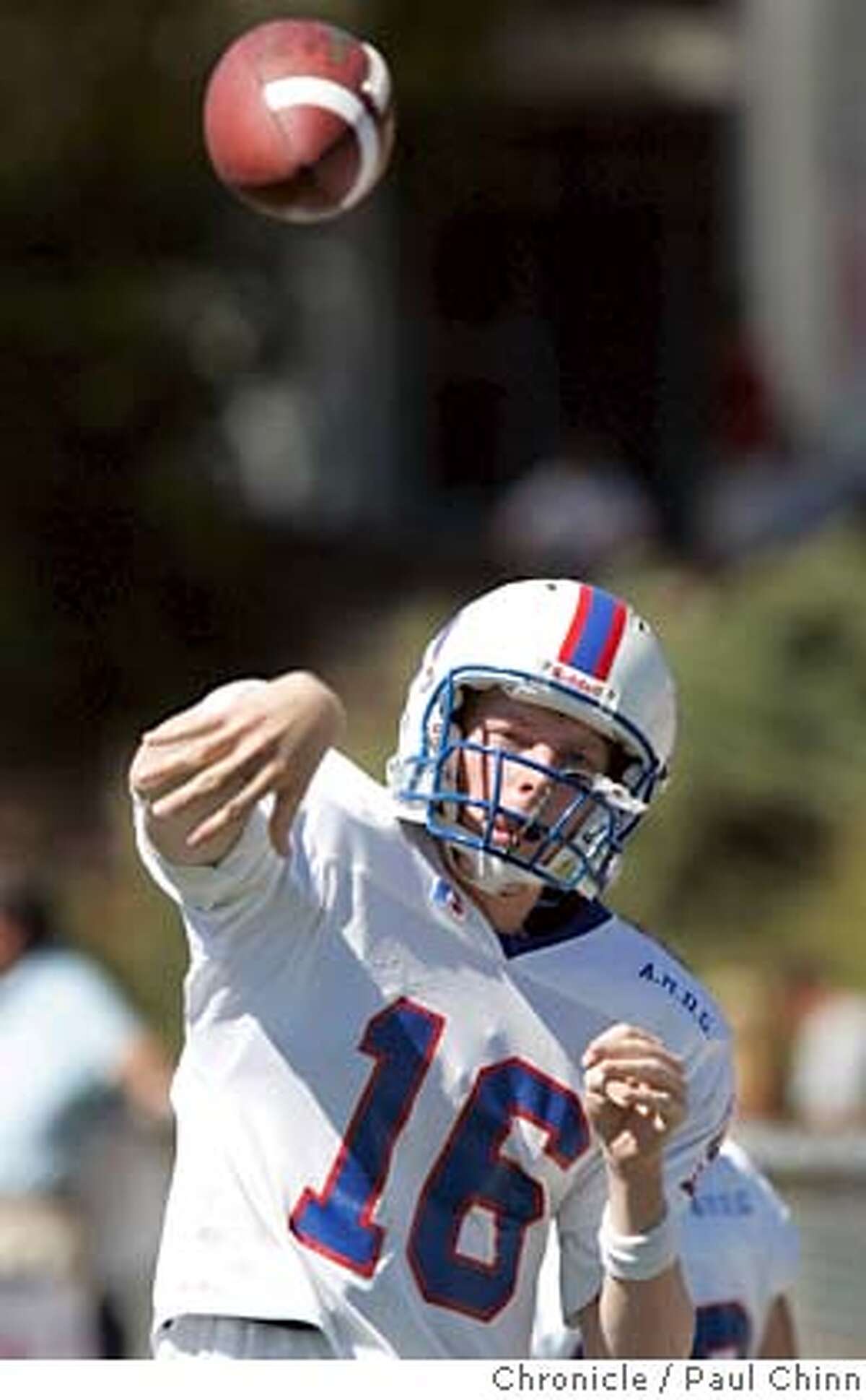 St. Ignatius quarterback Greg Mangan warms up on the sideline before entering the game in the 2nd quarter. St. Ignatius vs. Marin Catholic prep football game on 9/11/04 in Kentfield, CA. PAUL CHINN/The Chronicle