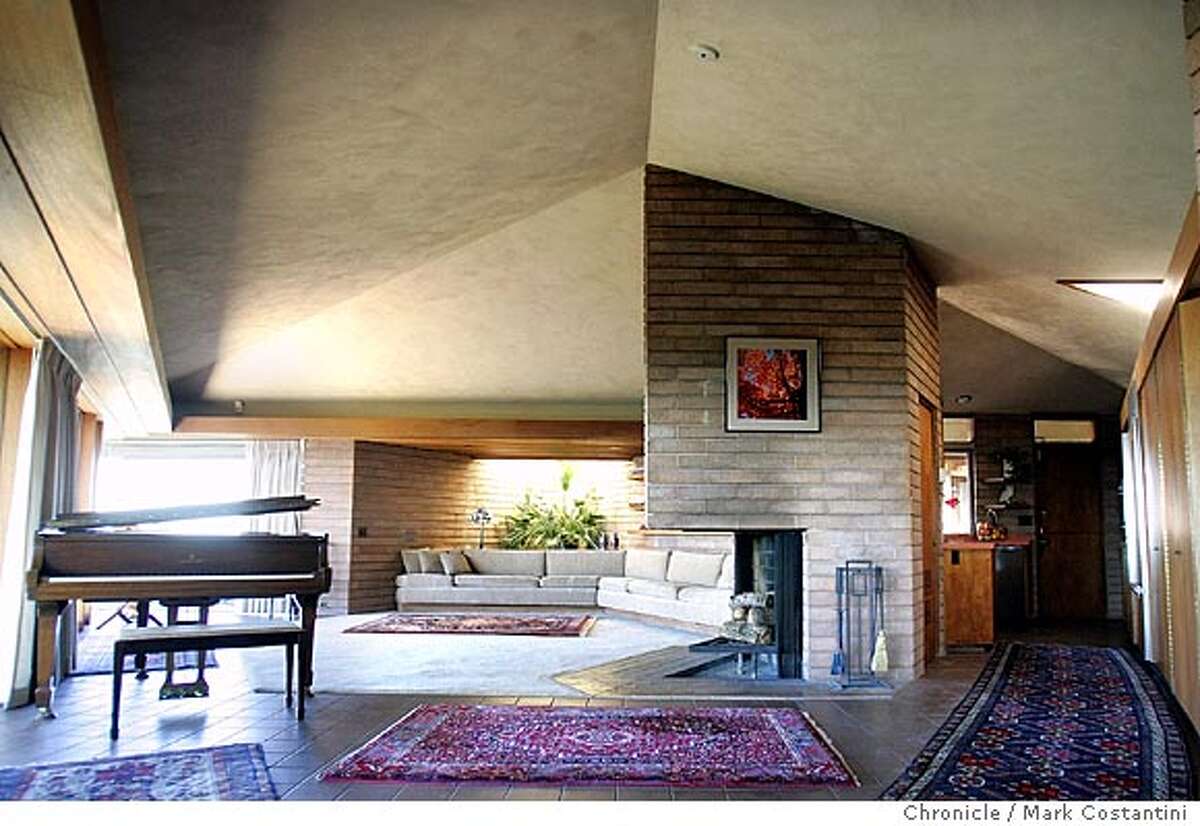 interior of the house of Phil and Pat Shoptaugh in Oakland that was designed by architect Aaron Green in 1956. Green, a disciple of Frank Lloyd Wright, created houses with wide overhanging eaves, with natural materials, open plans, and lots of glass. The houses are long and low with almost no right angles. Mark Costantini / The Chronicle Mark Costantini / The Chronicle